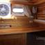 A wooden motor yacht with a salon and two cabins +1 bathroom + 1WC +  swimming platform and awning + sunbathing area.  