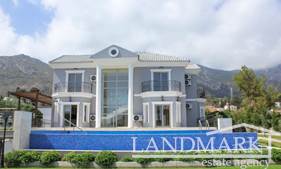 3 bedroom LUXURY villa + infinity swimming pool + central heating + landscaped garden + wonderful views of the sea and mountains  + Title deed ready to transfer 