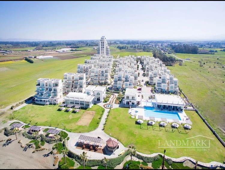 3-bedroom garden apartment + communal pool + beachfront  + Title deed in the owner’s name VAT paid + Turkish title deed