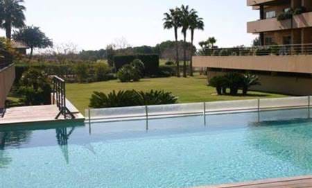 A beautiful deluxe large 2 bed 2 bath ground floor apartment in one of Vilamoura most exclusive condominiums San Zenone next to the Millennium and Laguna golf course club house.