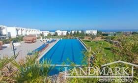 2-bedroom resale garden apartment + fully furnished + communal swimming pools + indoor swimming pool + gym + sauna + steam room + Pilates and yoga room + restaurant + on-site generator + walking distance to the beach + fabulous sea and mountain views