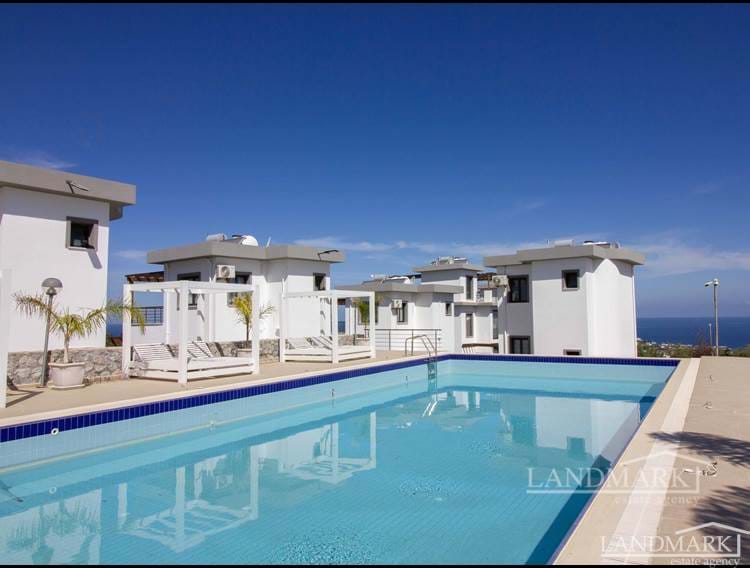 1 yatak odalı ikinci el villa + ortak yüzme havuzu + merkezi ısıtma altyapısı + deniz ve dağ manzarası 